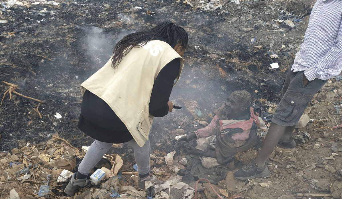 Grace Kantchentche interviewing a waste picker at Mzedi dumpsite in Blantyre