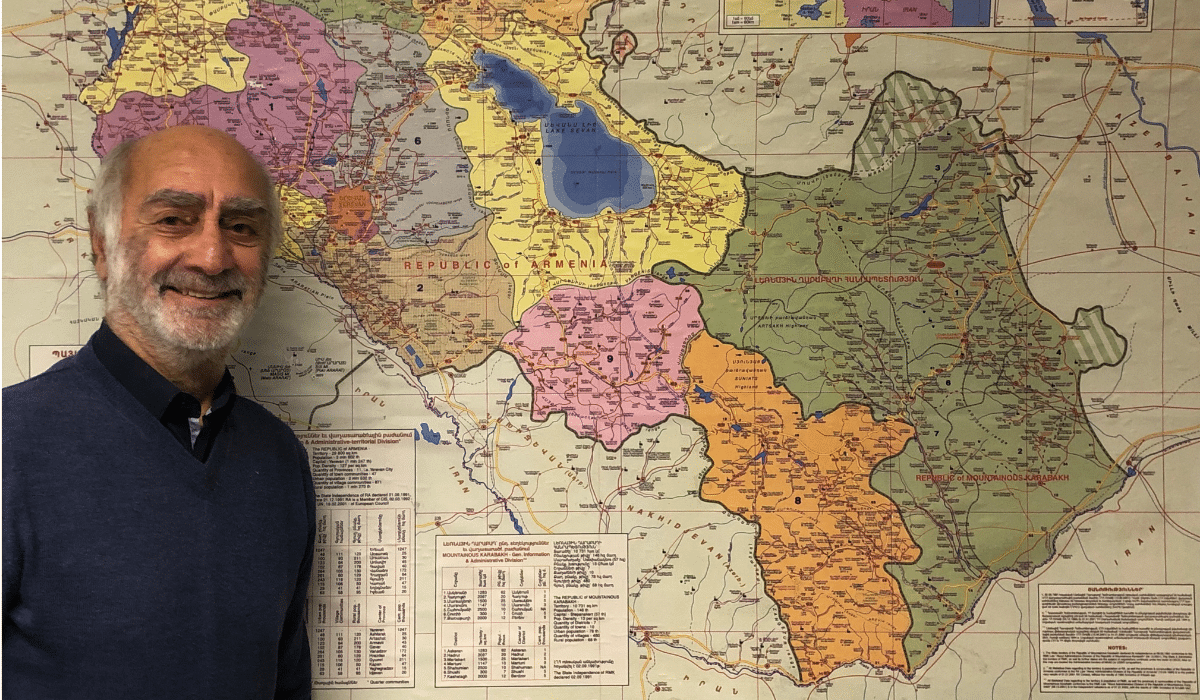 Henri Papazian, president of AYP FM, in his office in front of the historical map of Armenia