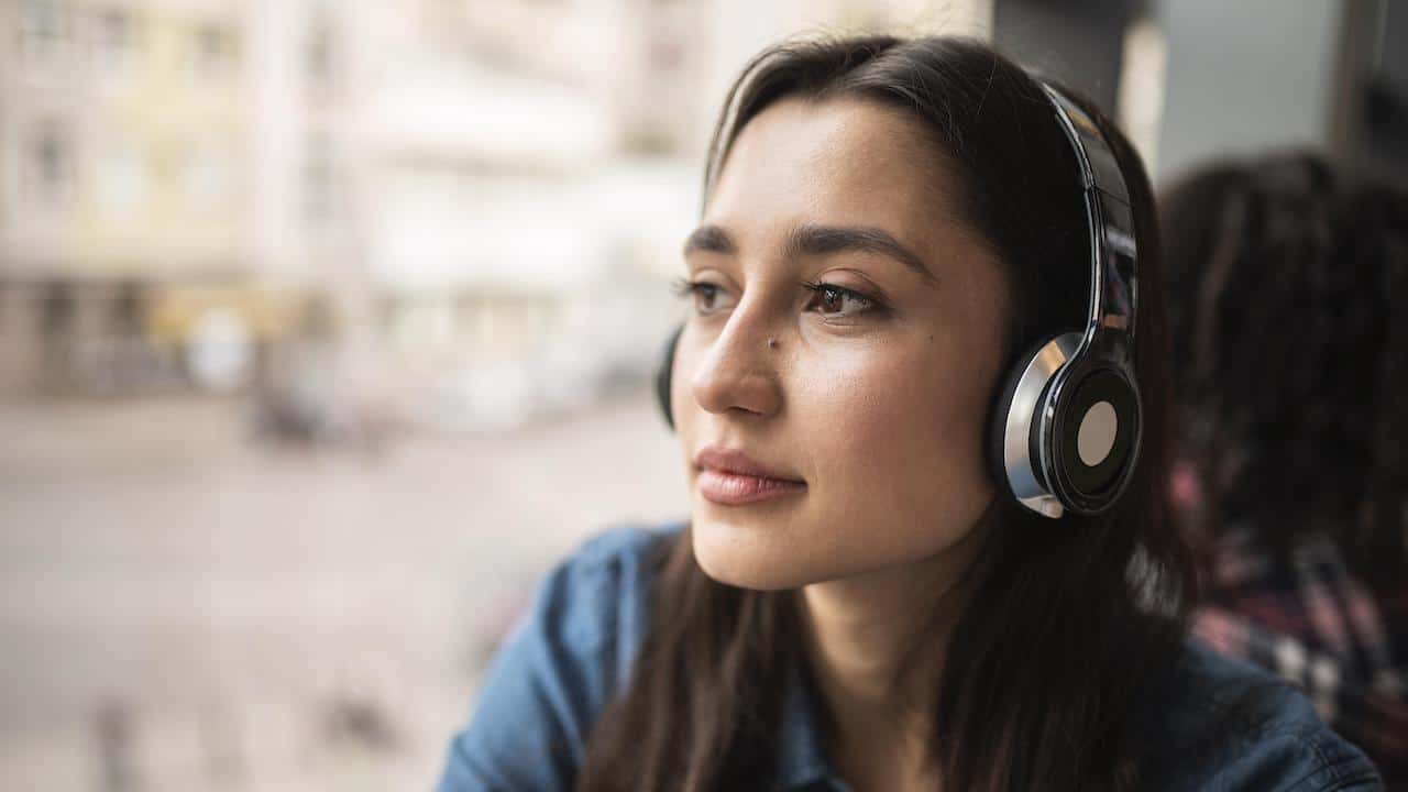 CRA woman listening to podcasts