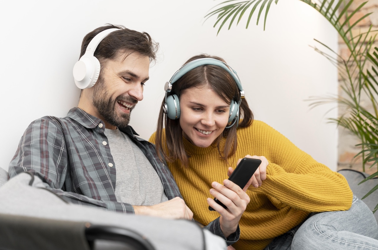 Man and woman listening to podcasts